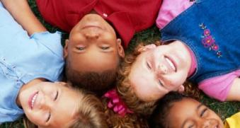 Circle of Kids Looking at Camera
