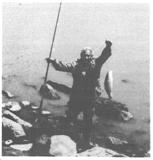 a fisherman showing off his catch