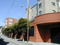 This mixed-use project retains contiguous retail along Gough Street by providing garage access on Hickory Alley