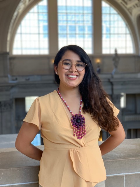 image of Itzel smiling in front of the camera